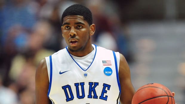 March 24, 2011; Anaheim, CA, USA; Duke Blue Devils guard Kyrie Irving (1) moves the ball down court against the Arizona Wildcats during the first half of the semi finals of the west regional of the 2011 NCAA men's basketball tournament at the Honda Center. Mandatory Credit: Gary A. Vasquez-USA TODAY Sports